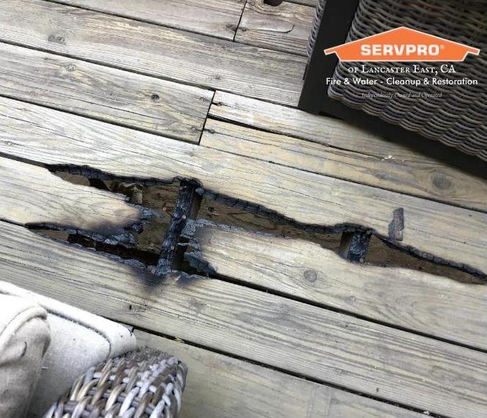 charred deck with burned plywood