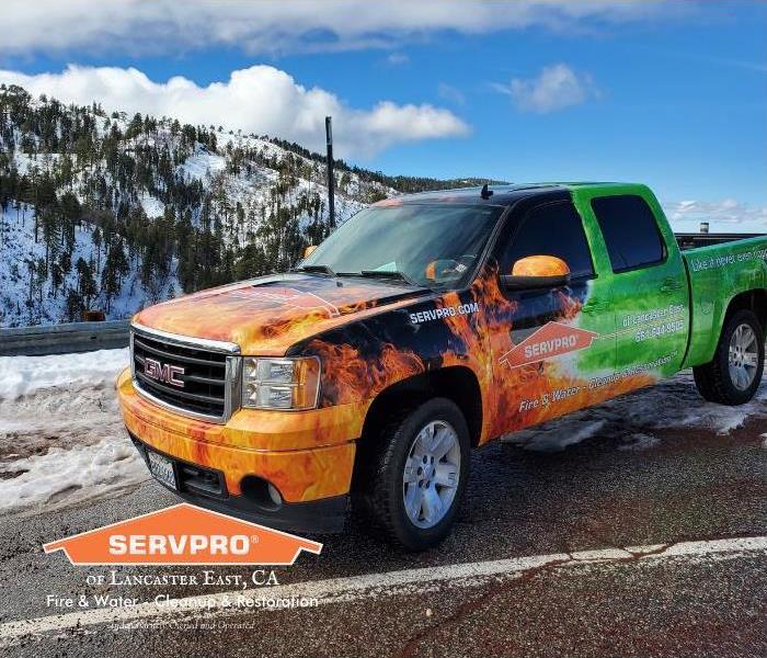 SERVPRO truck with snowy mountains behind